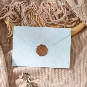 Vintage blue textured envelope with wax seal, elegant stationery for romantic letters and cards.