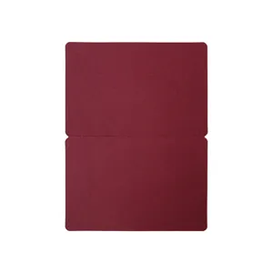 Close-up detail of a blank maroon folded cardstock paper with neat rounded corners.