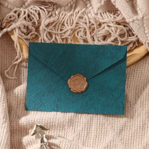 Dark green vintage envelope with wax seal, elegant minimalist letter paper set for notes.
