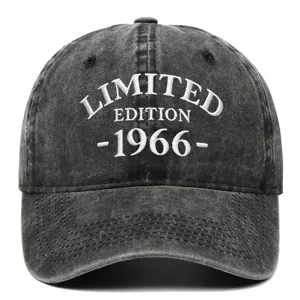 Detail view of a vintage black washed cotton baseball cap featuring white 1966 embroidery
