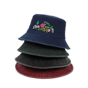 Stacked vintage washed cotton bucket hats featuring delicate floral embroidery detail