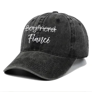 Close-up view of the 'Fiancé' embroidery on a premium vintage washed black baseball cap