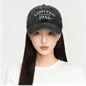 Washed black cotton baseball cap with white 1956 embroidery shown on an Asian model