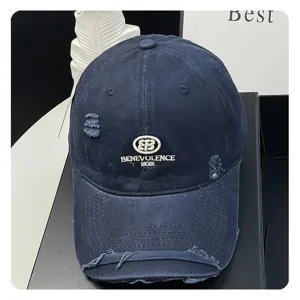Distressed navy blue baseball cap with embroidered logo, casual cotton dad hat for women.