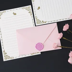 Pink envelope and stationery paper set with cute rabbit pattern and wax seal decoration.