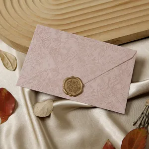 Vintage textured envelope with wax seal detail, elegant retro stationery closeup view.