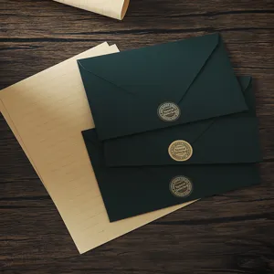 Vintage dark green envelope and lined letter paper stationery set for elegant writing.