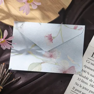 Vintage floral blue paper envelope with embossed 3D flower pattern for wedding letter writing