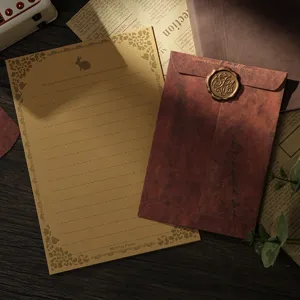 Vintage kraft paper writing stationery set with retro envelope and wax seal for letter writing.