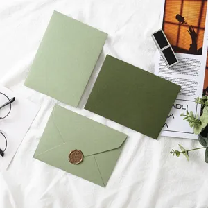 Avocado green envelope set with wax seal, elegant stationery for greeting cards and letters.