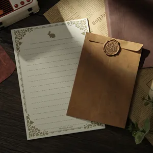 Vintage stationery set with kraft envelope wax seal and lined writing paper for letters.