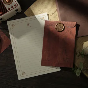 Vintage retro stationery set with distressed envelope, writing paper and wax seal for letters.