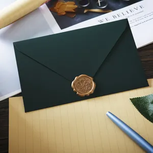 Dark green envelope and letter paper set with retro wax seal stamp for romantic stationery.