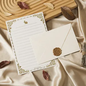 Vintage stationery letter paper and envelope set with retro floral design and wax seal stamp.