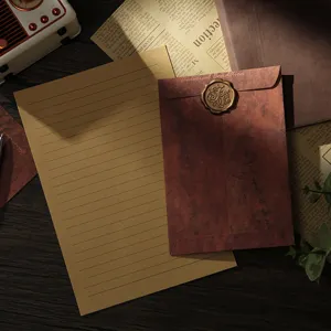 Vintage kraft paper stationery set with retro envelope, wax seal, and lined writing paper.