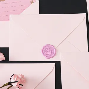 Pink envelope and stationery set with wax seal, elegant romantic letter paper for love confession.