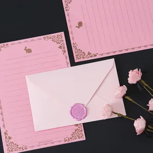 Pink envelope and letter paper set with gold floral design and wax seal sticker for romantic use.