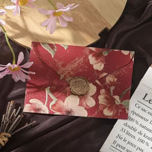 Retro floral embossed envelope with vintage wax seal, elegant stationery detail for letters.
