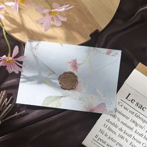 Exquisite floral embossed envelope detail with vintage wax seal, elegant stationery and letter set.