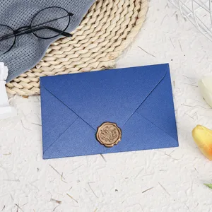 Blue pearlescent envelope with wax seal, elegant stationery for cards, letters, and invitations.