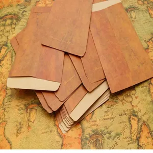 Vintage kraft paper envelopes stationery set detail showing retro design and texture.