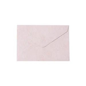 Pink textured paper envelope detail, elegant retro style stationery item for special letters.