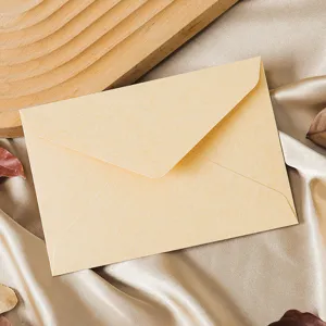 Vintage style textured paper envelope close-up view, perfect for wedding invitations and letters.