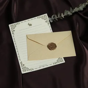 Vintage linnen textuur envelop en briefpapier set met waxzegel voor retro wenskaarten en brieven.