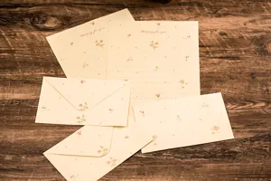 Close-up details of cute floral stationery set with delicate letter paper and envelopes.