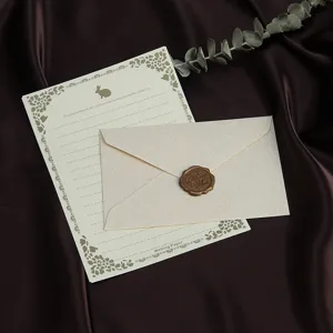 Vintage linnen textuur briefpapier en envelop set met waszegel voor retro brief schrijven.