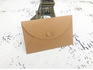 Kraft paper envelope with heart clasp for letters, retro stationery packaging accessory.