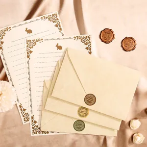 Vintage stationery set with parchment texture envelopes, letter paper, and wax seal stickers.