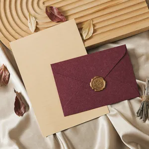Retro vintage stationery letter paper and envelope detail view with wax seal and dry leaves decor