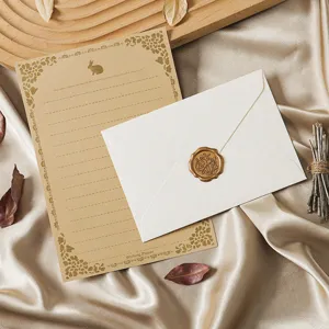 Vintage stationery set with kraft letter paper, elegant envelope and wax seal for writing.