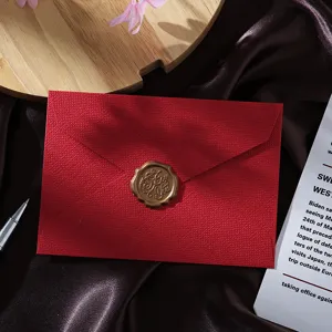 Vintage red burlap texture envelope with gold wax seal for wedding invitations letters.