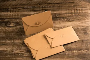 Kraft paper envelopes set with heart clasp design, retro vintage stationery for creative letters.