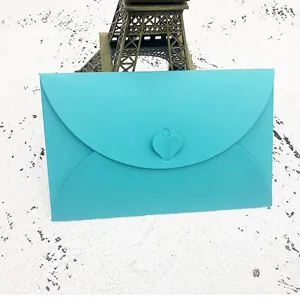 Turquoise paper envelope with heart clasp, elegant romantic love letter stationery.