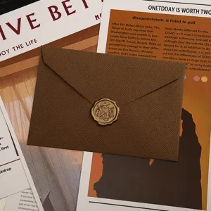 Ensemble d'enveloppes et de papier à lettres texturés rétro avec cachet de cire pour lettres.