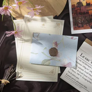 Details of vintage floral stationery letter paper and envelope set with elegant wax seal stamp.