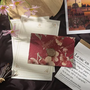 Vintage floral stationery set detail featuring embossed envelopes, writing paper, and wax seal.