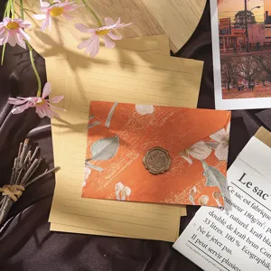 Close-up detail shot of the vintage floral stationery and envelope set with elegant design.