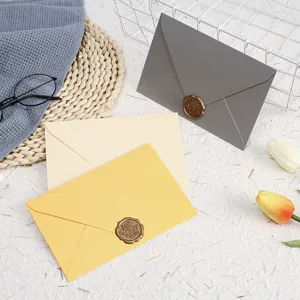 Colorful paper envelopes set with delicate wax seals, elegant stationery for letters and cards.