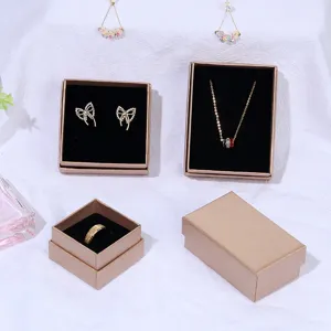 Display of champagne-colored jewelry gift boxes for rings, earrings, and necklaces