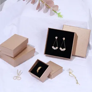 Elegant champagne gold jewelry gift boxes with black velvet inserts for rings and earrings