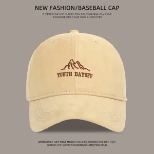 Classic beige baseball cap with embroidered mountain and stylish text design for everyday wear.