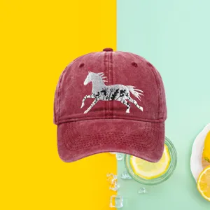 Washed burgundy cotton baseball cap with a detailed white floral horse embroidery