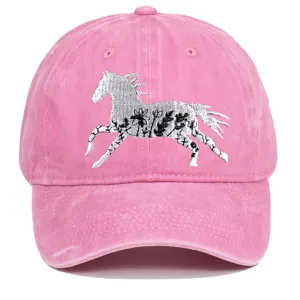 Close-up detail of a pink washed cotton baseball cap featuring an artistic horse embroidery