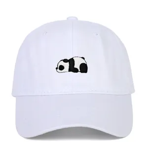 Detailed macro view showing the cute panda embroidery on the front of a white baseball cap