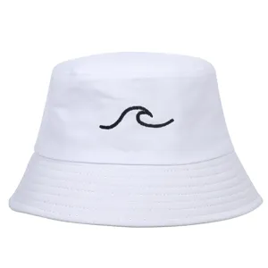 Close-up detail of a white cotton bucket hat with a minimalist black wave embroidery
