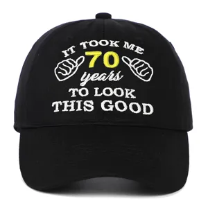 Detailed macro view of embroidery on a black 70th birthday gift cotton baseball cap.
